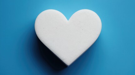 Obraz premium White foam heart shape on blue background. Minimalist love symbol, clean design for health or eco concepts. Abstract simple form with soft texture.