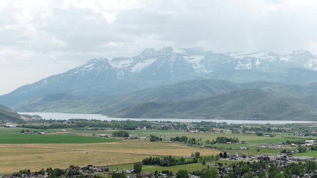 Aerial of Deer Creek Reservoir and snow capped Wasatch Range in Utah in spring