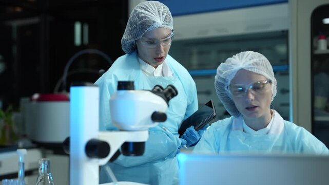Environmental scientist testing water quality sample for microplastics and chemical contaminants in laboratory.