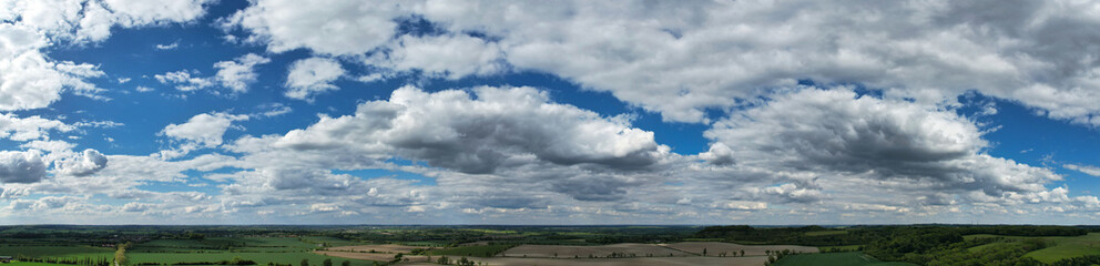 Obraz premium High Angle Panoramic View of British Countryside and Landscape of Bedfordshire England on 15th May, 2026. Drone Camera Footage Was Captured Medium High Altitude During Bright Sunny Day