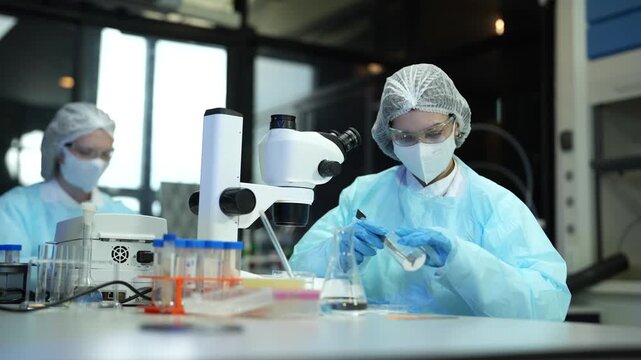 Forensic scientist examines unknown white powder in petri dish during crime lab investigation, criminology, analysis, evidence, and science.