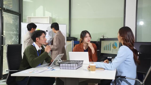 Asian businessman discuss with new startup project Idea presentation, analyze planning and financial statistics and investment market at office.