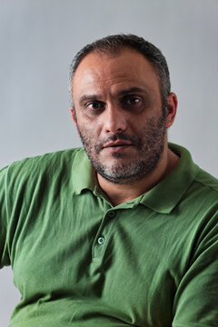 Serious Middle Eastern Man with a beard Looking Directly At the Camera