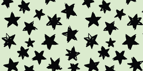 Fototapeta premium Hand Drawn Black Star Seamless Pattern on Pastel Green Background