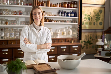 Fototapeta premium Happy young female chemist working in laboratory.