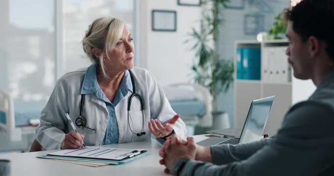Doctor, talking and clipboard with man in office for checkup, symptoms notes and medical results. Woman, consultation or person with evaluation checklist, patient information and healthcare treatment