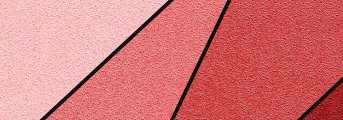 Fototapeta premium ABSTRACT GEOMETRIC PLASTER WALL WITH PINK AND CORAL TONES AND BLACK DIAGONAL SHAPES - MODERN ARCHITECTURE AND STUCCO DESIGN CREATE A CONTEMPORARY ARTISTIC COMPOSITION