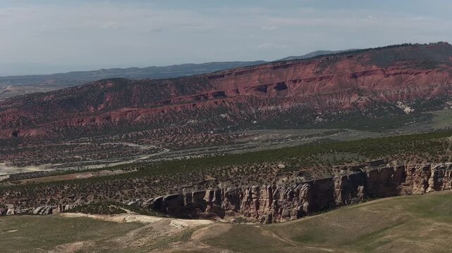 Aerial of Vernal Utah red rock canyon in high desert terrain in spring