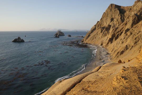 Paracas, Peru - 3 Dec 2025: Sunset on the Pacific coast in the deserts of the Paracas National Reserve, Peru