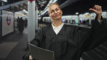 Naklejka premium Judge woman reads a sheet of paper and gestures with her hand on a subway platform in a building; authority dignity.