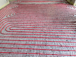 Fototapeta premium Installation of underfloor heating system in building, above view