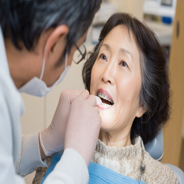 Senior woman receiving orthodontic treatment with dental braces