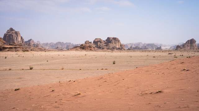 Lifeless desert landscape with sand and huge sandstone rock formations, Tabuk, Saudi Arabia