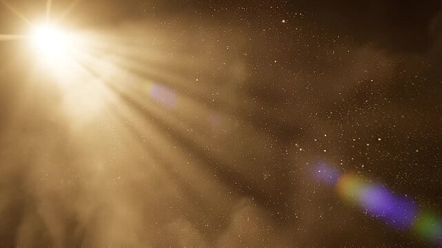 Golden spotlight beam cutting through atmospheric smoke and dust particles creating a dramatic and ethereal stage lighting effect with lens flare on a dark background