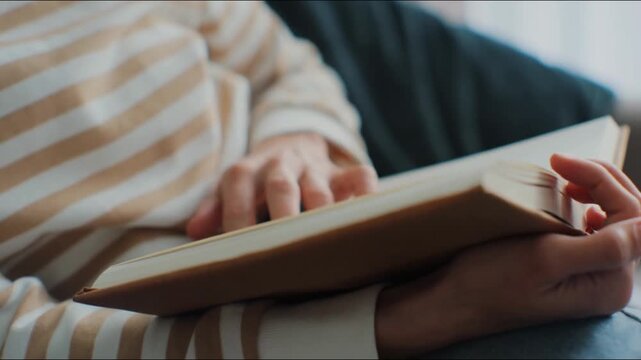 Woman hands reading book in home or library sit couch sofa education, learning knowledge. female person or student with novel or textbook story, literature studying. man reader notebook paper page