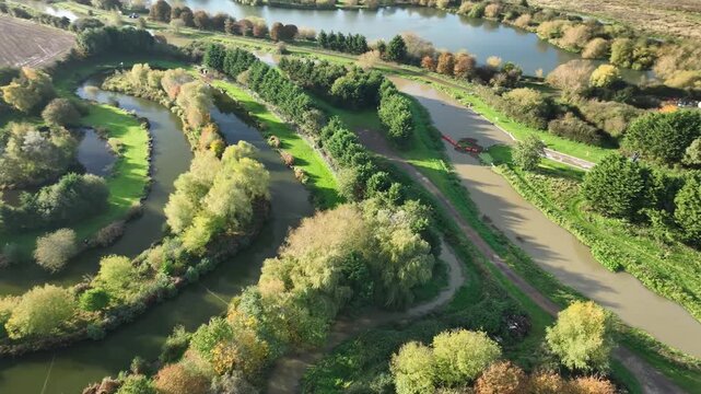 Aerial View of Meandering River Nene Through Autumn Countryside Northamptonshire England UK
