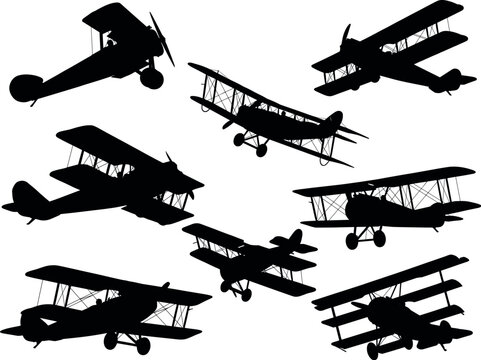 Collection of classic biplane and triplane aircraft silhouettes flying in various positions, isolated on a white background