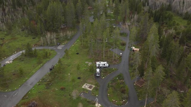Aerial of campground in Uinta National Forest in spring in Utah mountains on stormy day