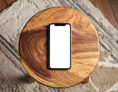 Smartphone with Blank Screen on Wooden Table
