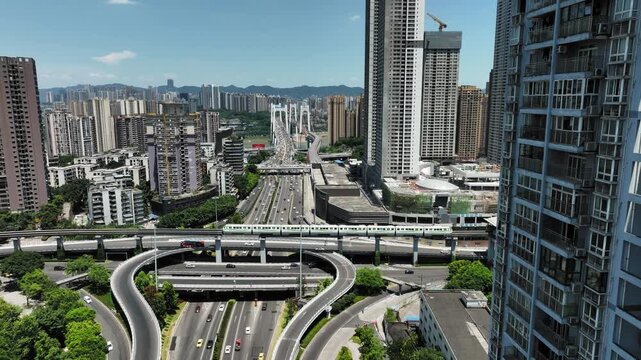 Tai Wai Hong Kong elevated train and highways among high rise buildings