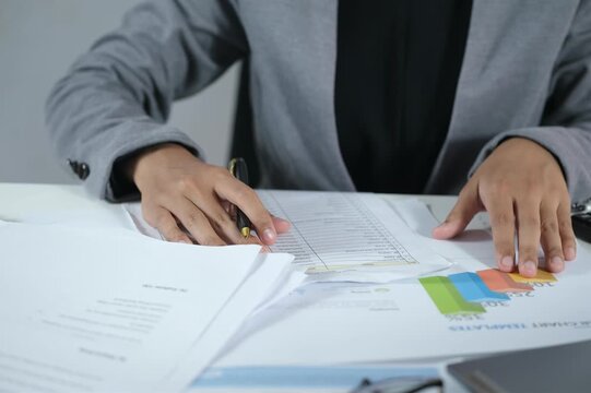 Workers analyzing and checking financial statement data. Financial data analysis and performance report statistics, Audit.
