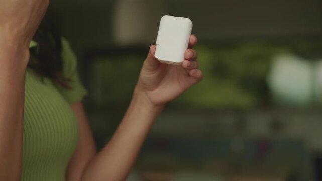 Close up of woman hands dispensing vitamin B pill from container, 4K slow motion