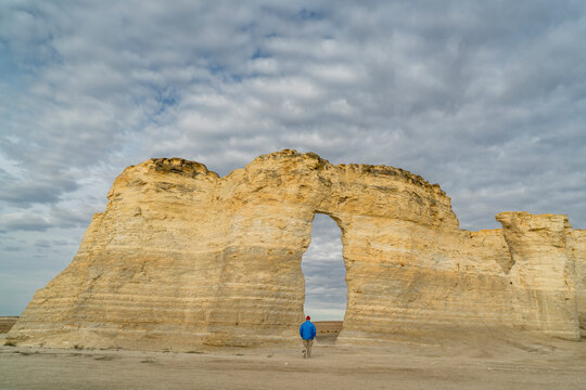lonely hiker at Monument Rocks  (Chalk Pyramids) in western Kansas