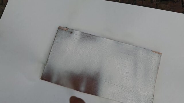 Painting a tree with white spray paint