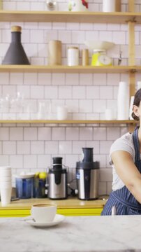 Coffee shop, walking and customer with drink and phone for service, online rating and loyalty program. Restaurant, happy and person on cellphone for cafe review, website and chat with beverage