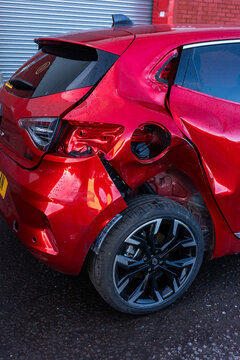 Glasgow UK: 13th Feb 2026: A damaged red car is parked in Glasgow. The rear section shows significant impact, and the gas cap area is open