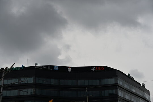 PZU, HP, UBS and PKO Logos on Top of Modern Office Building