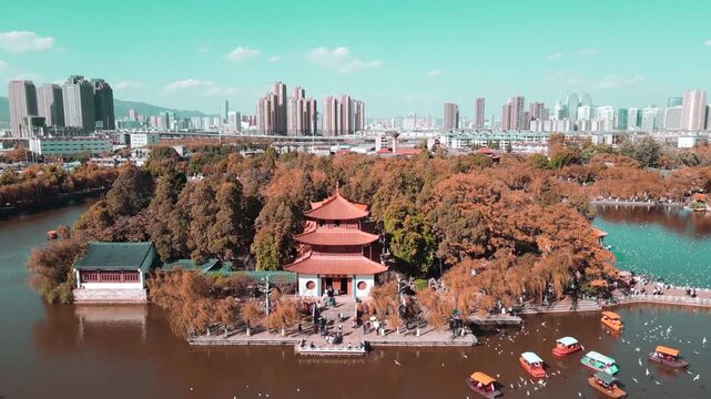 Green Lake Park pavilion in autumn with Kunming city skyline, China in Green Lake Park, Kunming, Yunnan, China