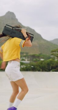 Spin, rollerskate and woman in park with radio for skating, hobby or audio on summer weekend. Skater, retro and person with music for practice, sports and playlist for skills, activity or fun outdoor