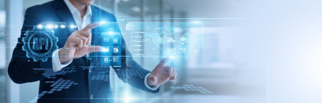 IT developer hands touch virtual screen linking API integrations. Smart network connections stream seamless data exchanges between software programs in real time. Dynamic coding systems.