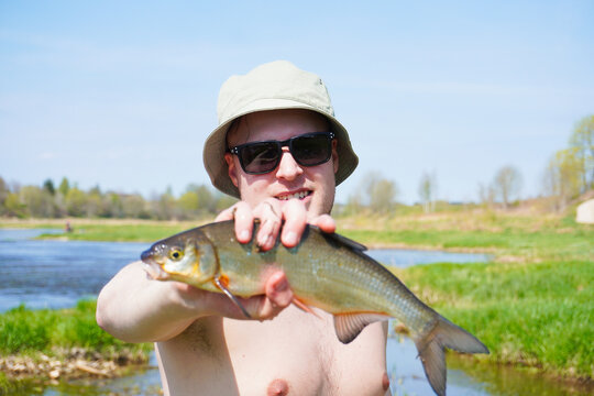 Close up of Fisherman Holding Vimba Fish by Venta River in Kuldīga Latvia