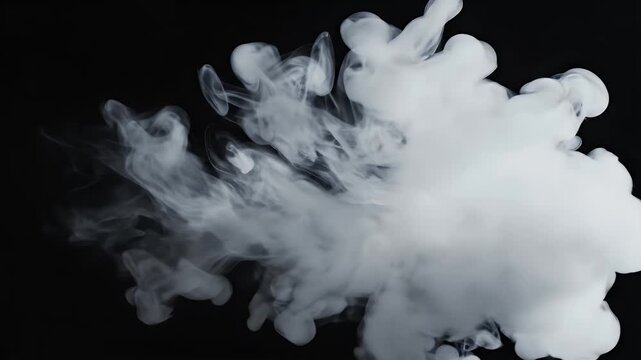 A dynamic and artistic shot captures the swirling motion of white ink or paint dispersing in black water, creating an abstract and visually striking composition.
