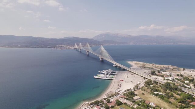 Aerial View of Rio Antirrio Bridge Modern Suspension Architecture over Blue Sea in Greece at Daytime