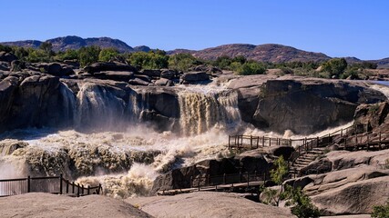 The tumultuous Orange River cascades over the Augrabies Falls  © Adrian