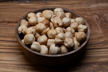 Fototapeta premium Beautiful and simple still life of shelled hazelnuts