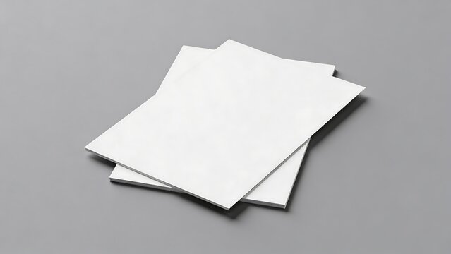 Blank white papers stacked and overlapping on grey background 