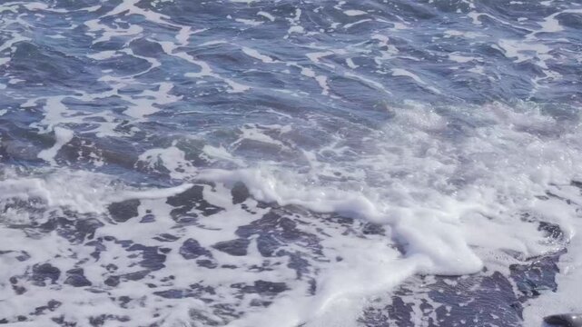 Atlantic Ocean waves crash gently on shore, warm Gulf Stream current, relaxing coastal scene, natural power, sea breeze, aquatic travel