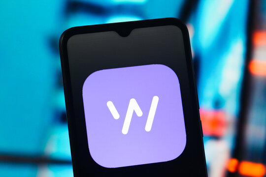 In this photo illustration, the Whisper logo is seen displayed on a smartphone screen.