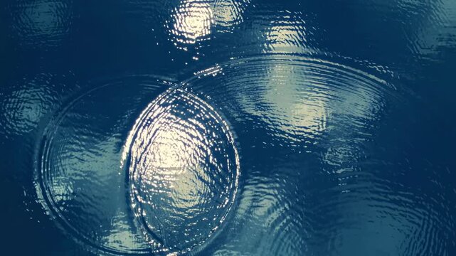 Ripples on a calm water surface reflect light and clouds. Circular patterns create a serene atmosphere. The scene evokes tranquility and nature's beauty.