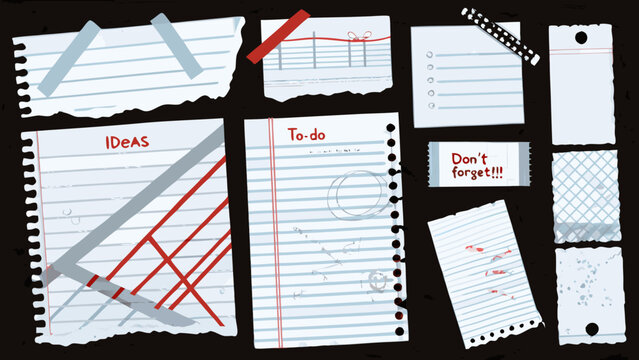 torn paper scraps with handwritten notes and tape isolated on a black background
