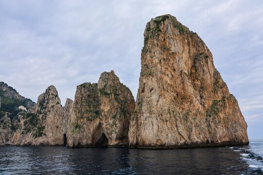 Faraglioni rocks standing in the sea off Capri island, Italy