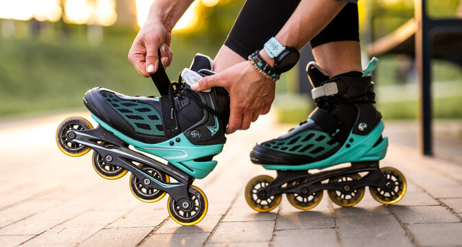 Woman Fastening Roller Skates