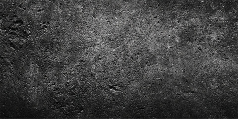 A dark gray grunge concrete wall with a rough black asphalt texture and a dirty aged stone pattern makes a perfect vintage material backdrop © MDNUR