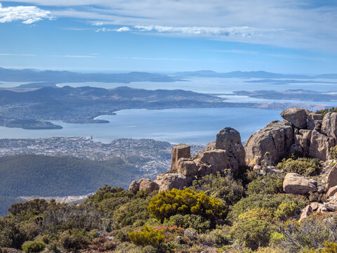 The unique dolerite cliffs of Mount Wellington with the city of Hobart and its harbor in the background, Tasmania, Australia