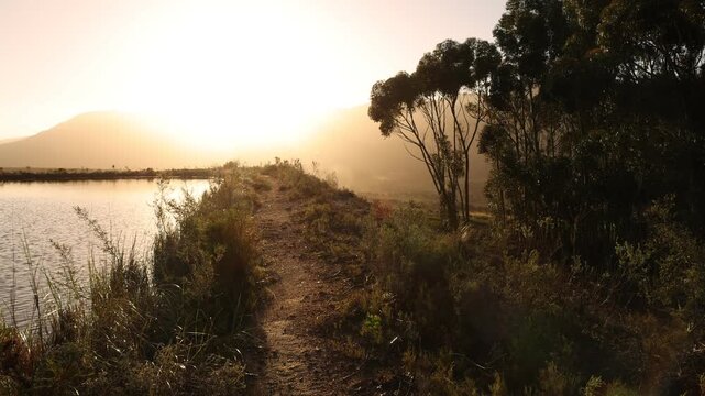 placid pond and trees overlooking Klein Mountains, Stanford, South Africa