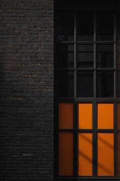 Portrait of orange window on black wall background 